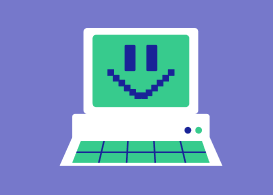 Desktop with pixelated happy face on monitor